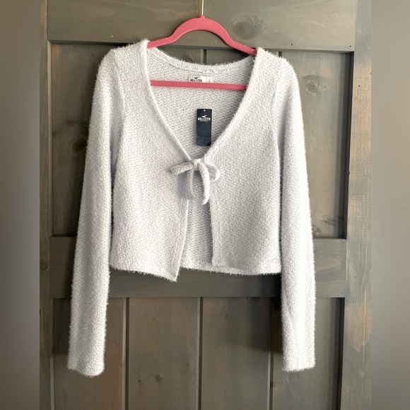Hollister Sweaters - NWT HOLLISTER 
Icicle BLue cardigan sweater 
BOW tie in front super soft